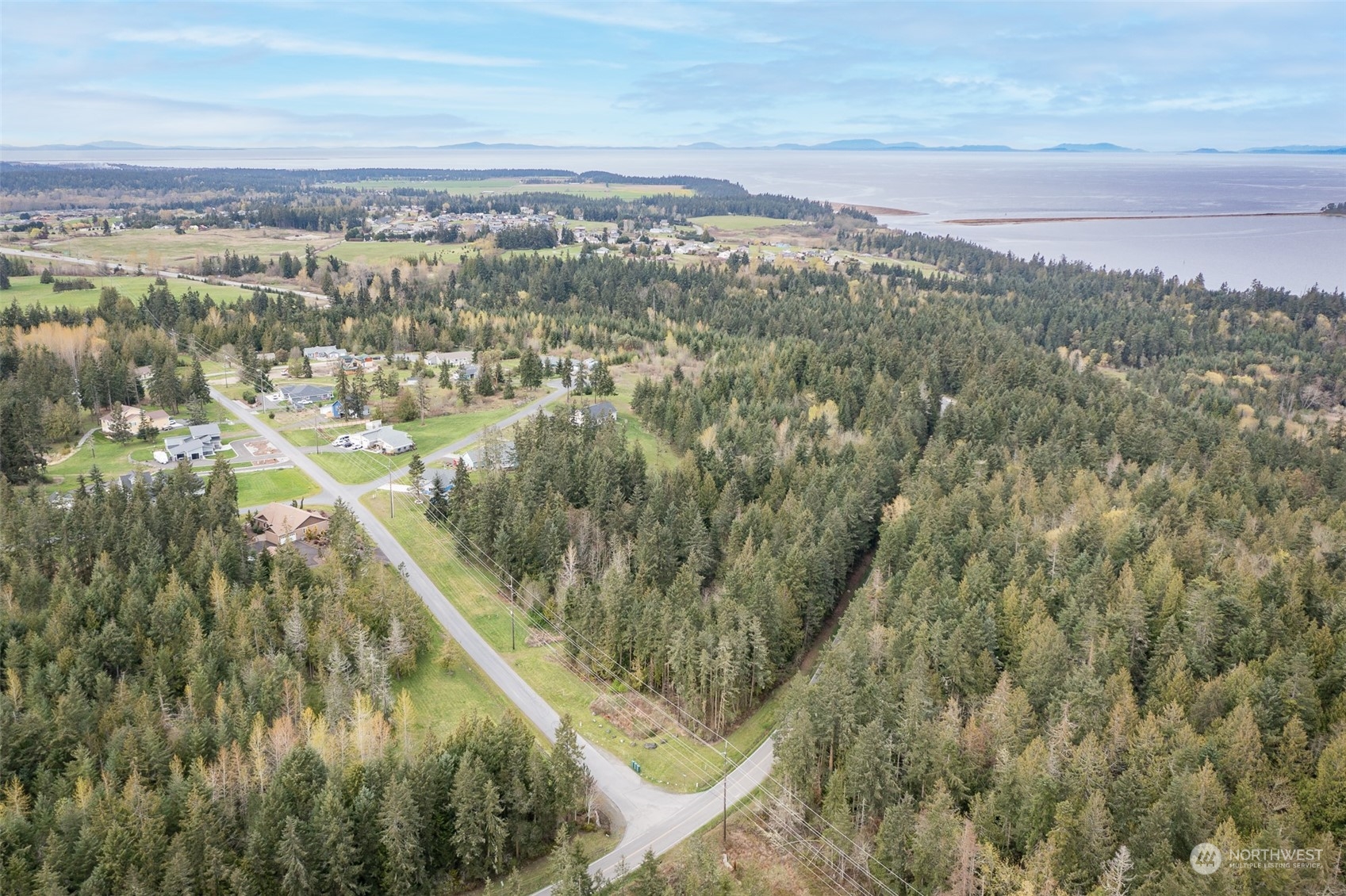 13 R Paul Joseph Terrace, Unit R Sequim, WA 98382 - Photo 3 of 12 a view of a city from a lake