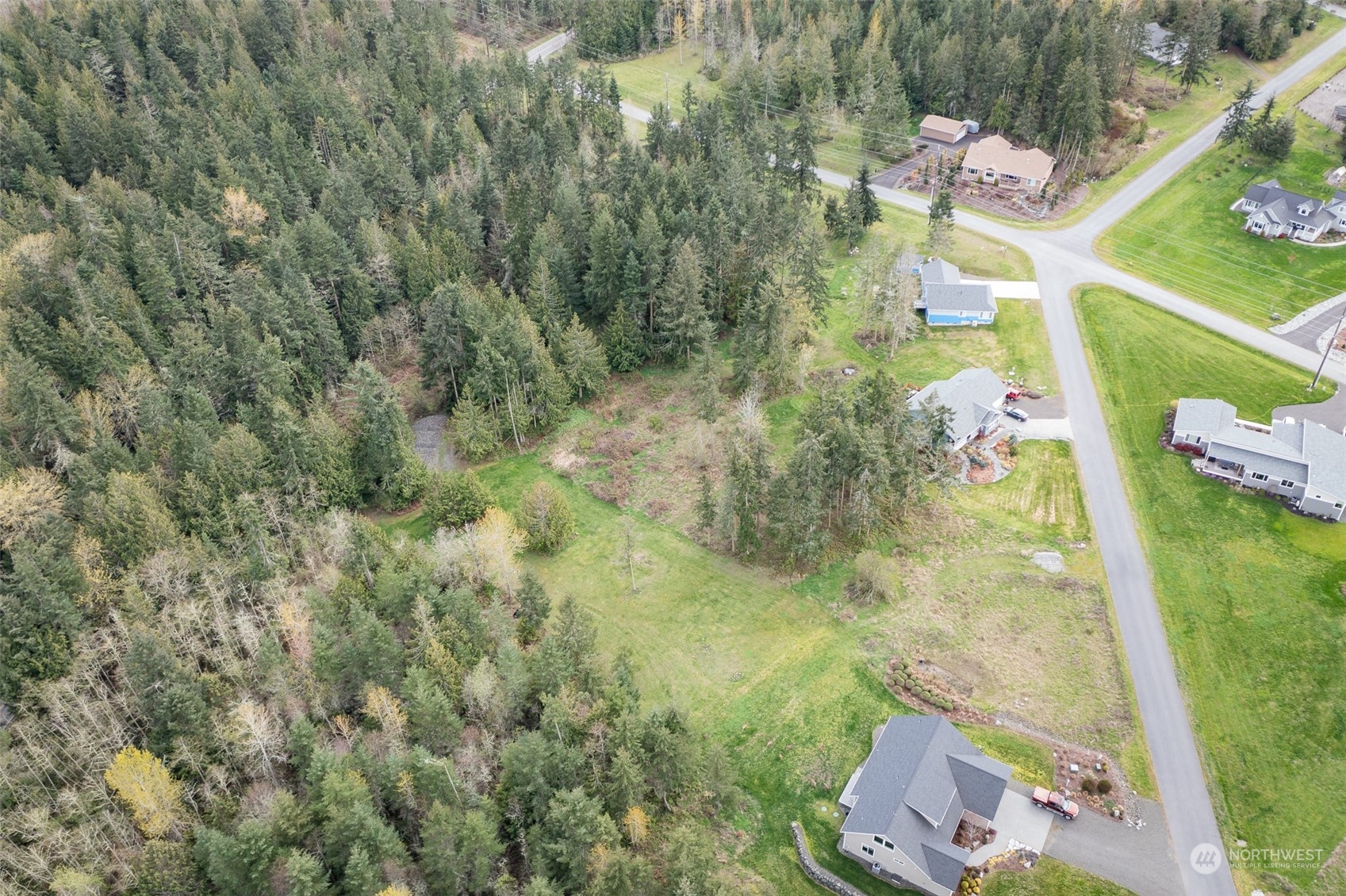 13 R Paul Joseph Terrace, Unit R Sequim, WA 98382 - Photo 6 of 12 an aerial view of residential houses with outdoor space