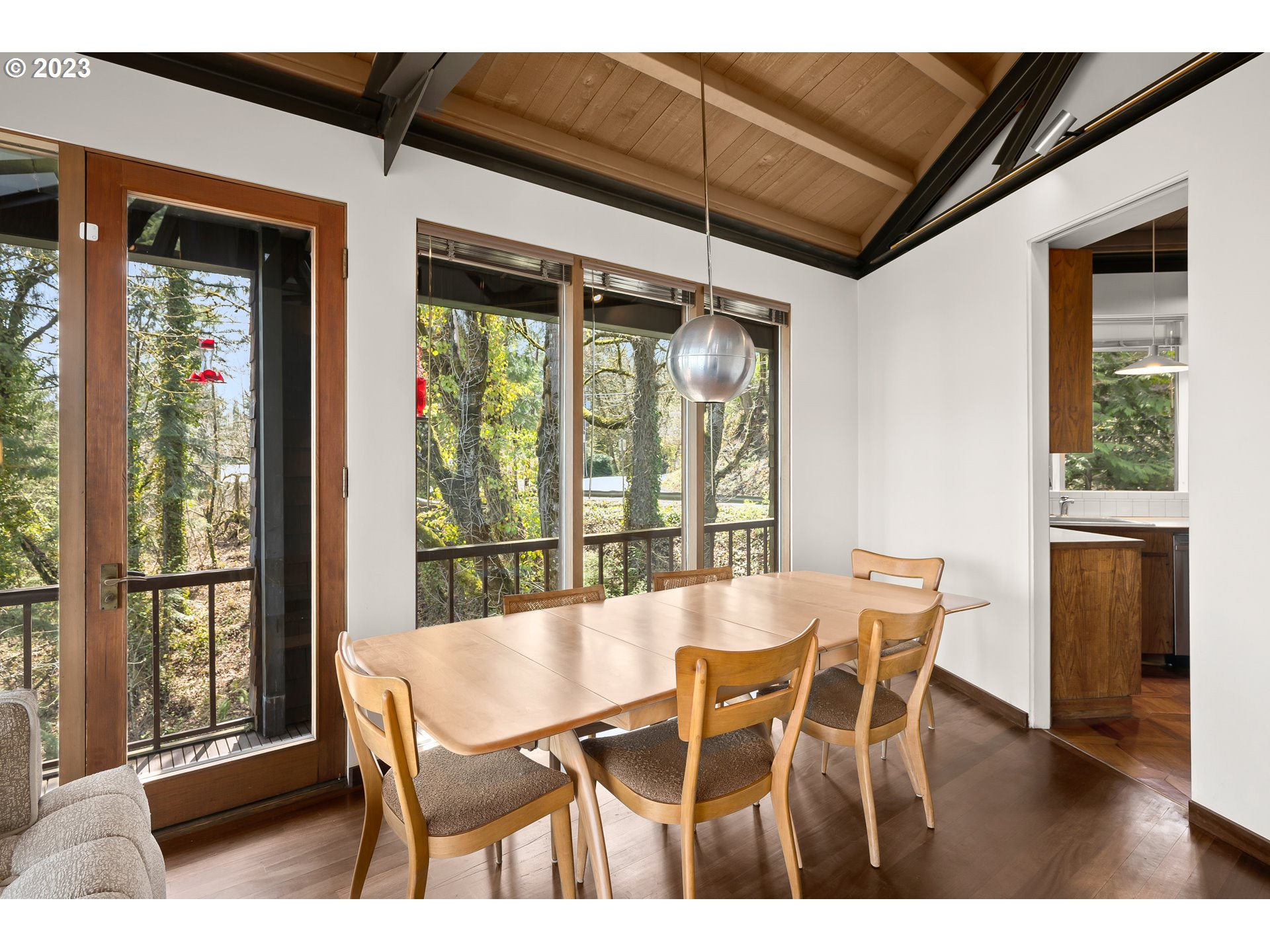 2880 Southwest Fairmount Boulevard Portland, OR 97239 - Photo 12 of 24 a view of a dining room with furniture window and wooden floor