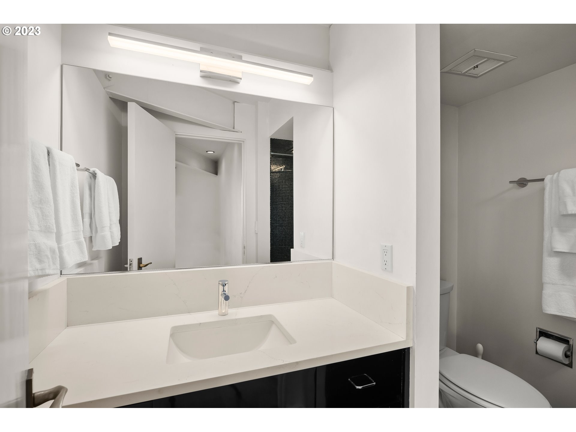 2880 Southwest Fairmount Boulevard Portland, OR 97239 - Photo 24 of 24 a bathroom with a sink and a mirror