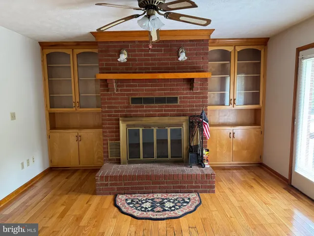 a view of a fireplace with wooden floor