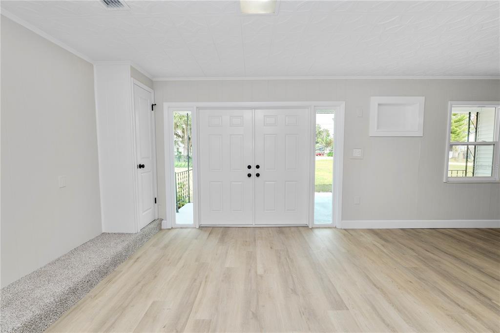 5105 Hayes Road Lakeland, FL 33811 - Photo 12 of 43 an empty room with wooden floor and windows