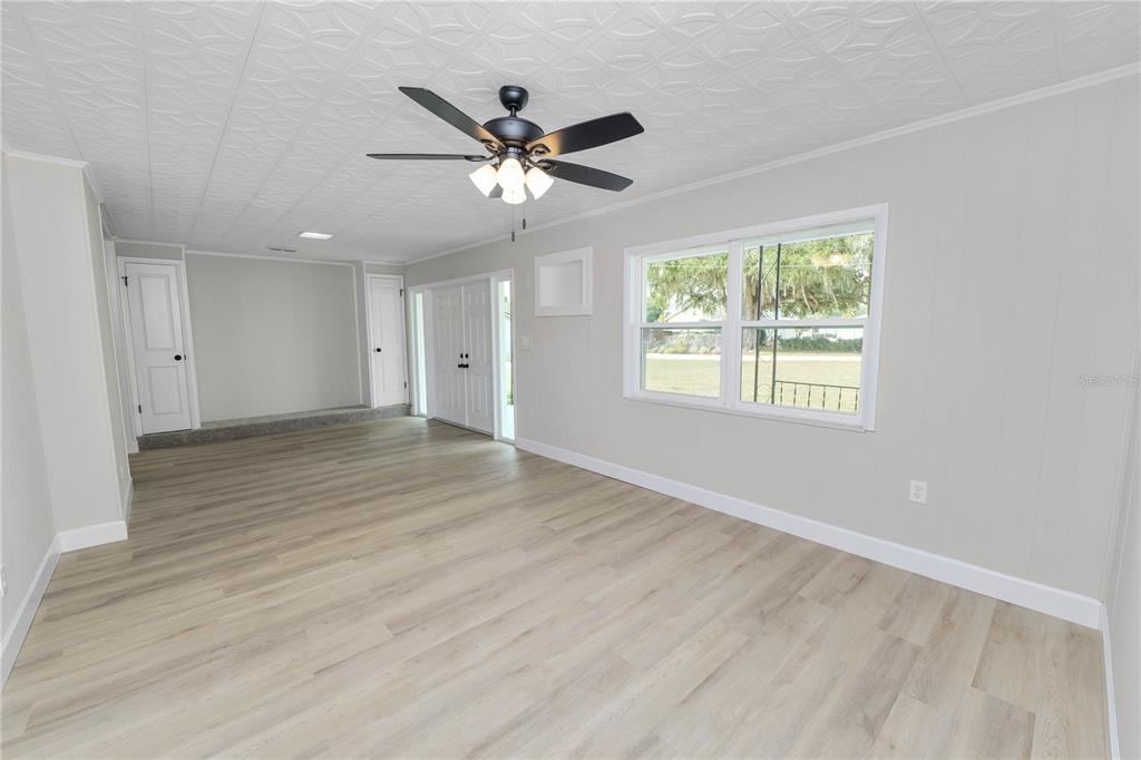 5105 Hayes Road Lakeland, FL 33811 - Photo 14 of 43 a view of an empty room with wooden floor and a window