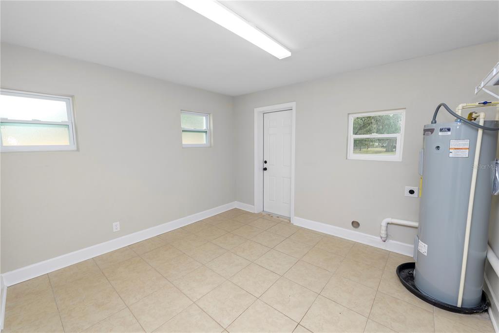 5105 Hayes Road Lakeland, FL 33811 - Photo 20 of 43 a view of a room with a refrigerator and washer