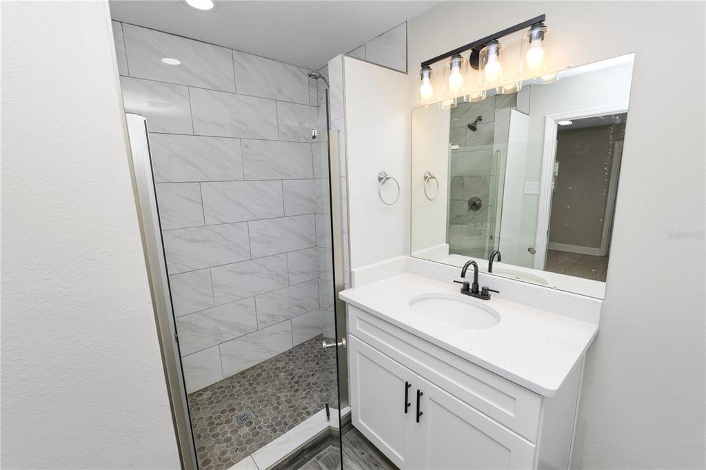 5105 Hayes Road Lakeland, FL 33811 - Photo 23 of 43 a bathroom with a sink and a mirror