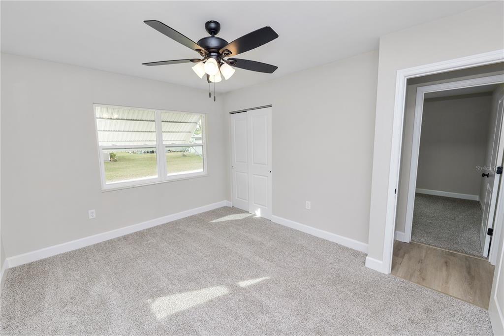 5105 Hayes Road Lakeland, FL 33811 - Photo 27 of 43 an empty room with windows and fan