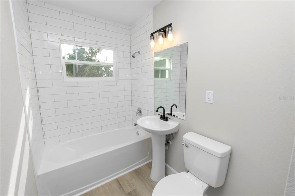 5105 Hayes Road Lakeland, FL 33811 - Photo 28 of 43 a white toilet sitting next to a bathroom sink