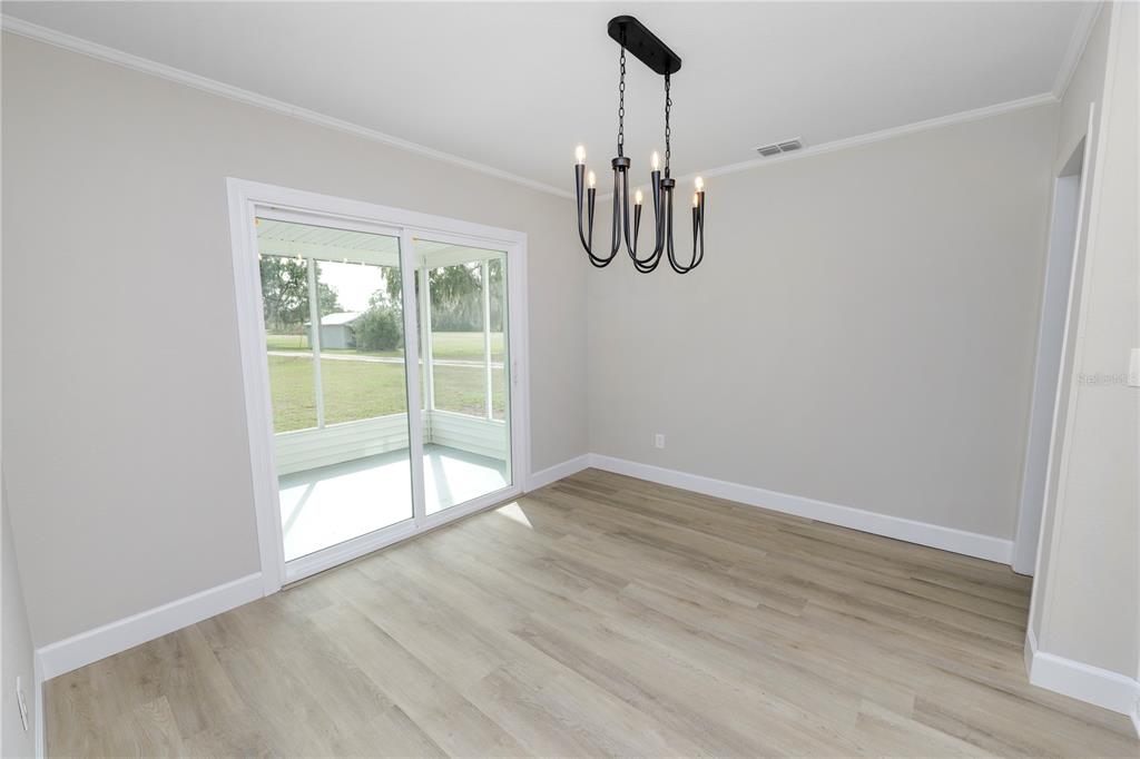 5105 Hayes Road Lakeland, FL 33811 - Photo 8 of 43 a view of a room with a window and wooden floor