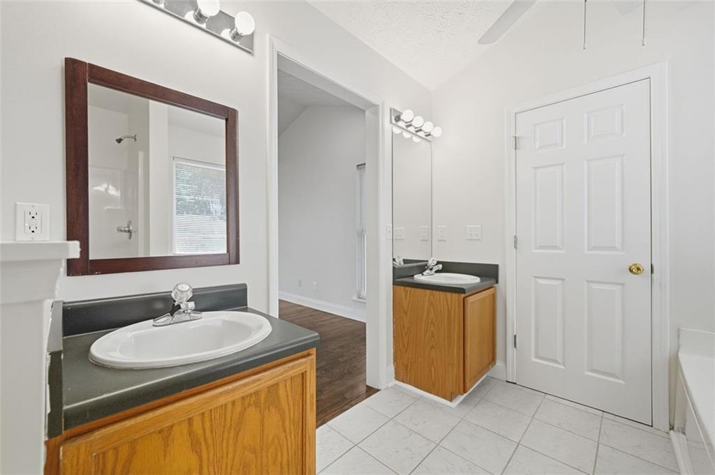 1512 Upper Sassafras Road Jasper, GA 30143 - Photo 21 of 35 a bathroom with a sink a mirror and a toilet