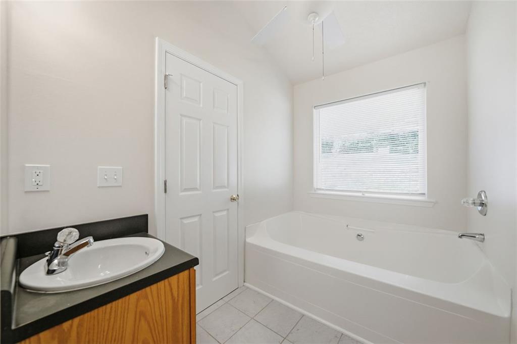 1512 Upper Sassafras Road Jasper, GA 30143 - Photo 22 of 35 a bathroom with a sink and a bathtub