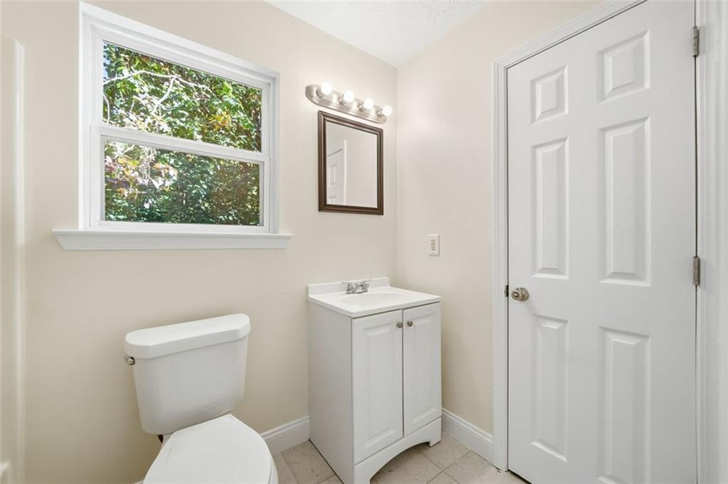 1512 Upper Sassafras Road Jasper, GA 30143 - Photo 28 of 35 a bathroom with a toilet a sink and a window