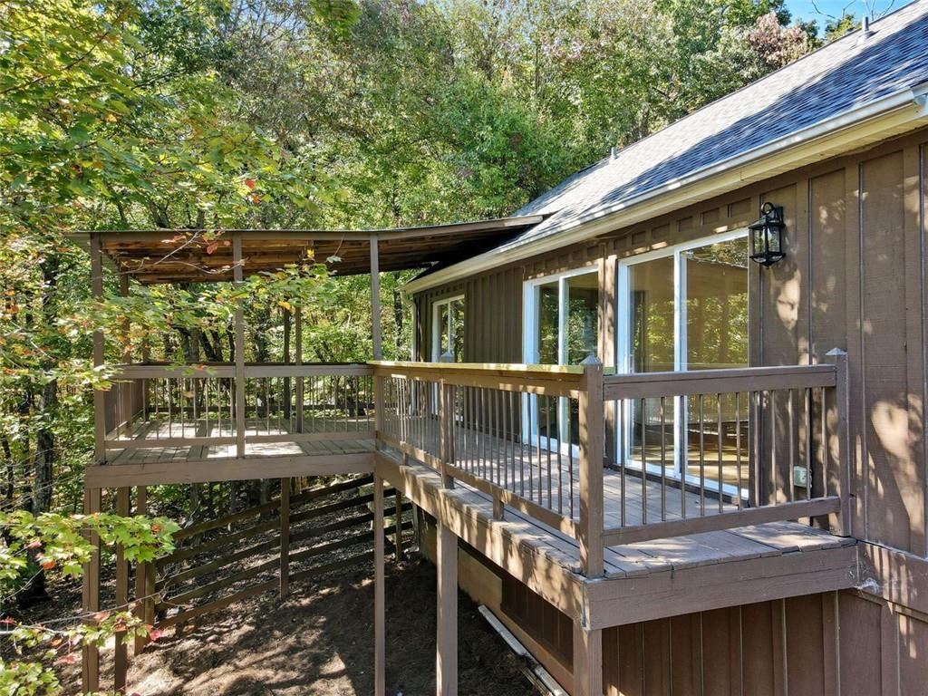 1512 Upper Sassafras Road Jasper, GA 30143 - Photo 3 of 35 a balcony with wooden floor and fence