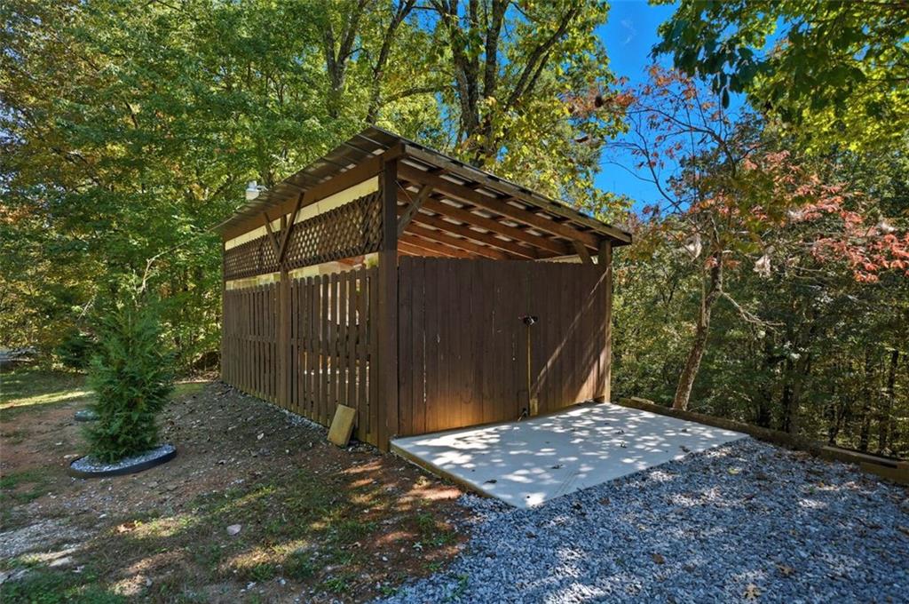 1512 Upper Sassafras Road Jasper, GA 30143 - Photo 35 of 35 a backyard of a house with lots of green space