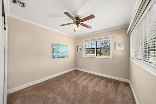 a view of a livingroom with wooden floor and furniture