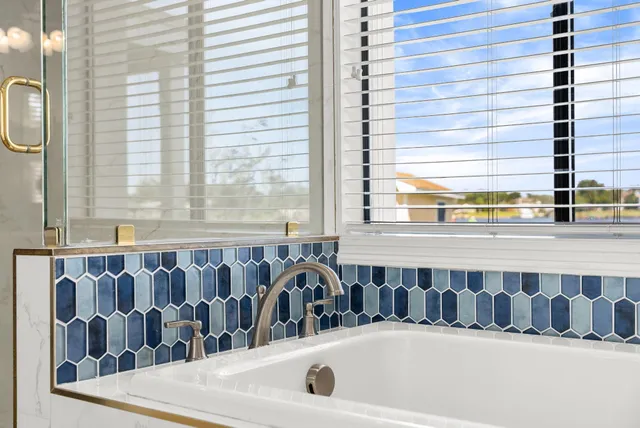 a view of a lake with couches in the patio