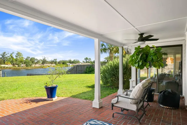 a view of a swimming pool with an outdoor seating