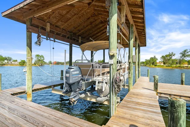an aerial view of a houses with a lake view