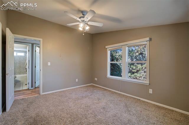 5860 Curtis Road Peyton, CO 80831 - Photo 20 of 28 Unfurnished bedroom with a ceiling fan, carpet, and baseboards