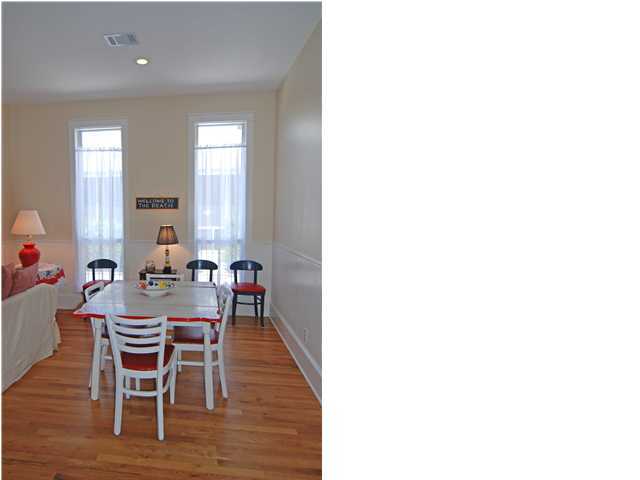 220 North Andalusia Avenue Santa Rosa Beach, FL 32459 - Photo 8 of 28 a dining room with furniture and wooden floor