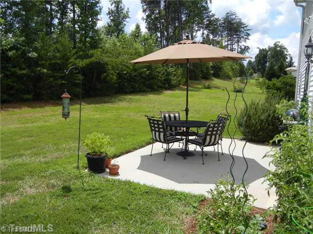 6925 Channel Forest Road Belews Creek, NC 27009 - Photo 1 of 16 Patio/Deck. Cozy patio overlooks private, level backyard! 15 light door opens to the Den and breakfast area.