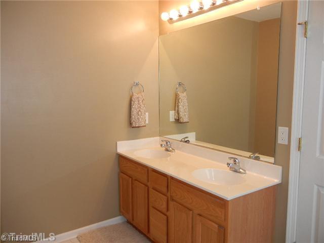 6925 Channel Forest Road Belews Creek, NC 27009 - Photo 10 of 16 Master Bath/Spa. Spacious master bath has double sinks, garden tub, 4 foot shower with a seat, and a separate toilet area for privacy!