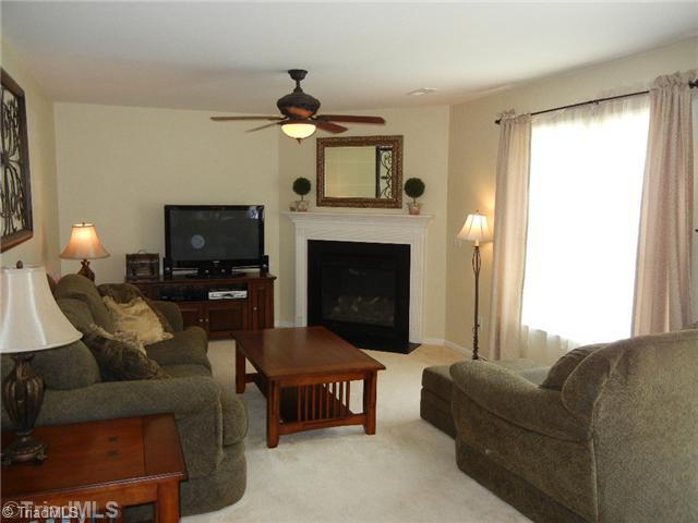 6925 Channel Forest Road Belews Creek, NC 27009 - Photo 2 of 16 Den/Family/Great Room. Neutral decor, ceiling fan, fireplace with mantle and gas logs, large picture window for natural light.