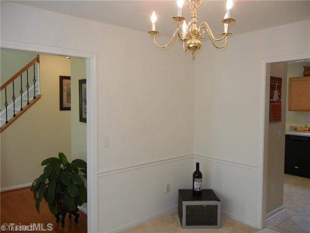 6925 Channel Forest Road Belews Creek, NC 27009 - Photo 6 of 16 Dining Room. Another view from the dining room to the foyer and the kitchen.