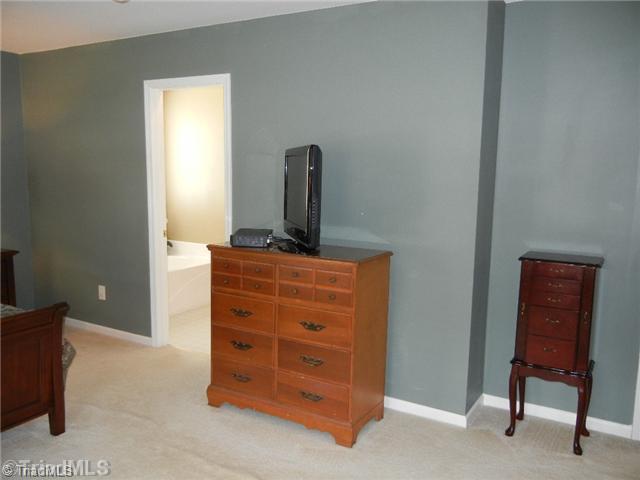 6925 Channel Forest Road Belews Creek, NC 27009 - Photo 9 of 16 Master Bedroom. Another view of the master bedroom shows extra wall space, master walk in closet is to the right of this view.