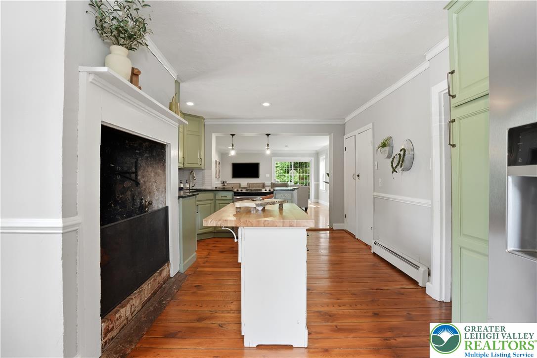 2014 Linden Street Bethlehem, PA 18017 - Photo 21 of 85 A rustic wood-plank floor and a decorative fireplace anchor this naturally illuminated kitchen.