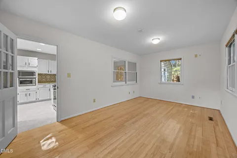 a view of an empty room with a window