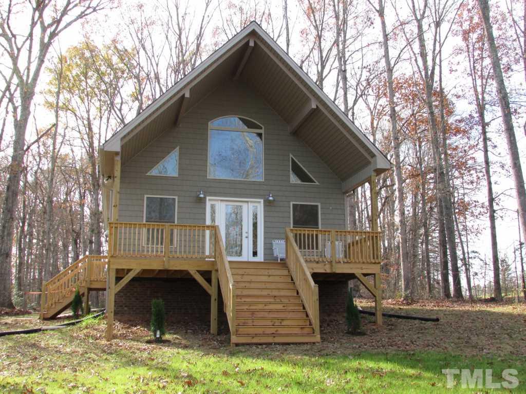 6477 Virgilina Road Roxboro, NC 27574 - Photo 1 of 20 a front view of a house with a yard