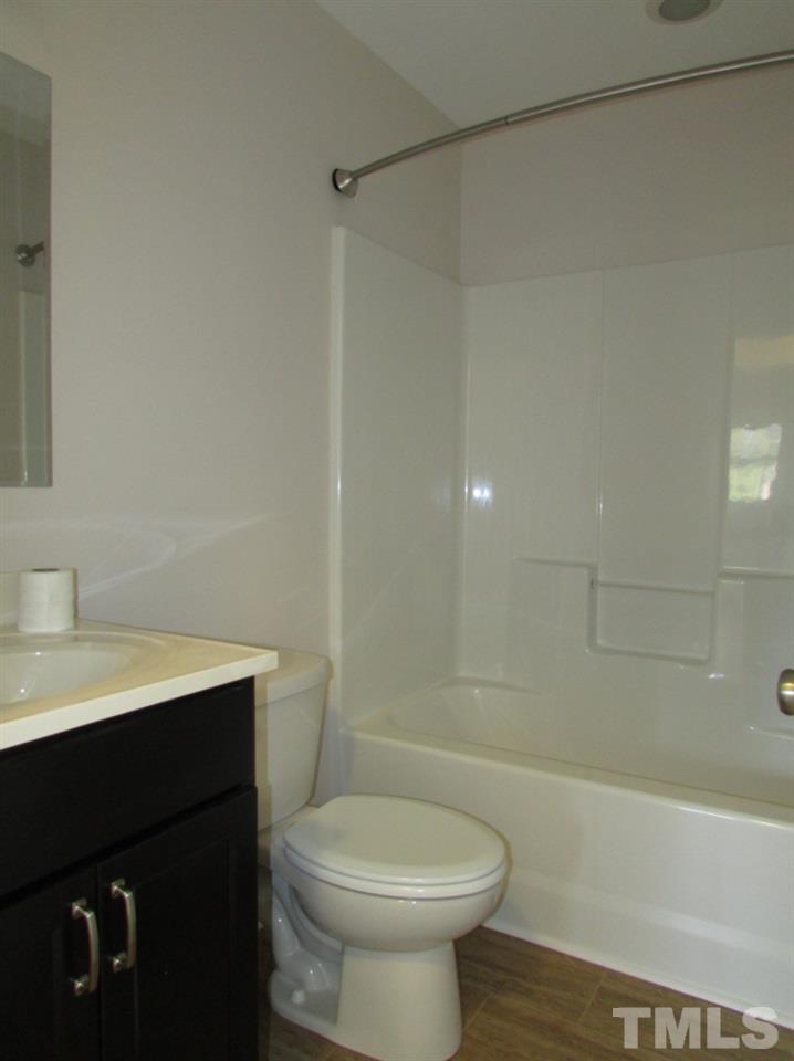 6477 Virgilina Road Roxboro, NC 27574 - Photo 16 of 20 a bathroom with a sink a toilet and shower