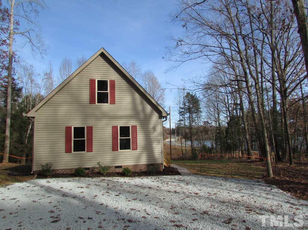 6477 Virgilina Road Roxboro, NC 27574 - Photo 19 of 20 a view of a house with a yard