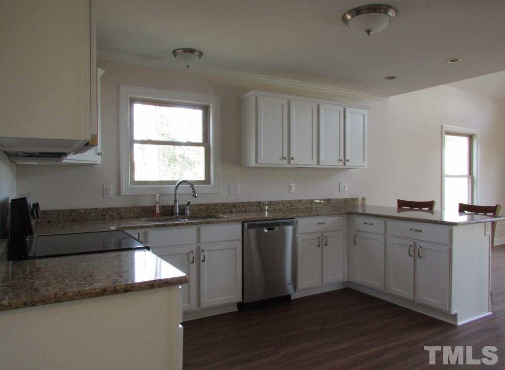 6477 Virgilina Road Roxboro, NC 27574 - Photo 4 of 20 a kitchen with stainless steel appliances granite countertop a sink and a stove