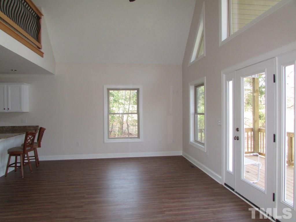 6477 Virgilina Road Roxboro, NC 27574 - Photo 8 of 20 a view of a livingroom with furniture window and wooden floor