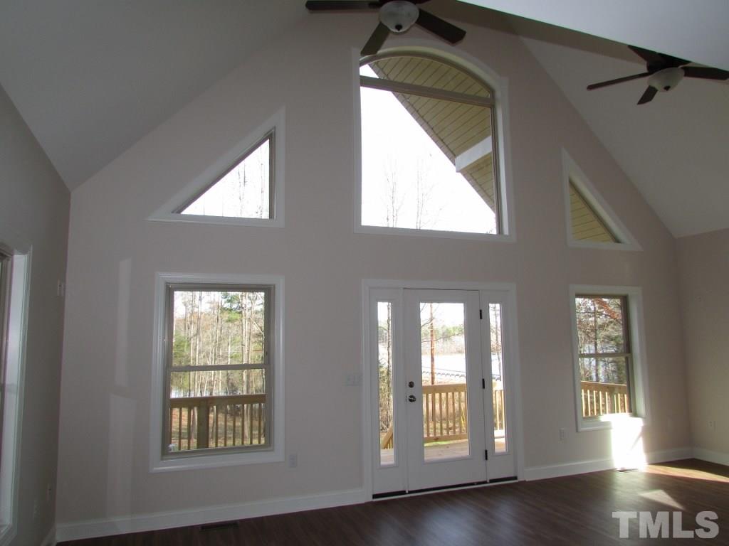 6477 Virgilina Road Roxboro, NC 27574 - Photo 9 of 20 a view of an entryway with wooden floor and windows