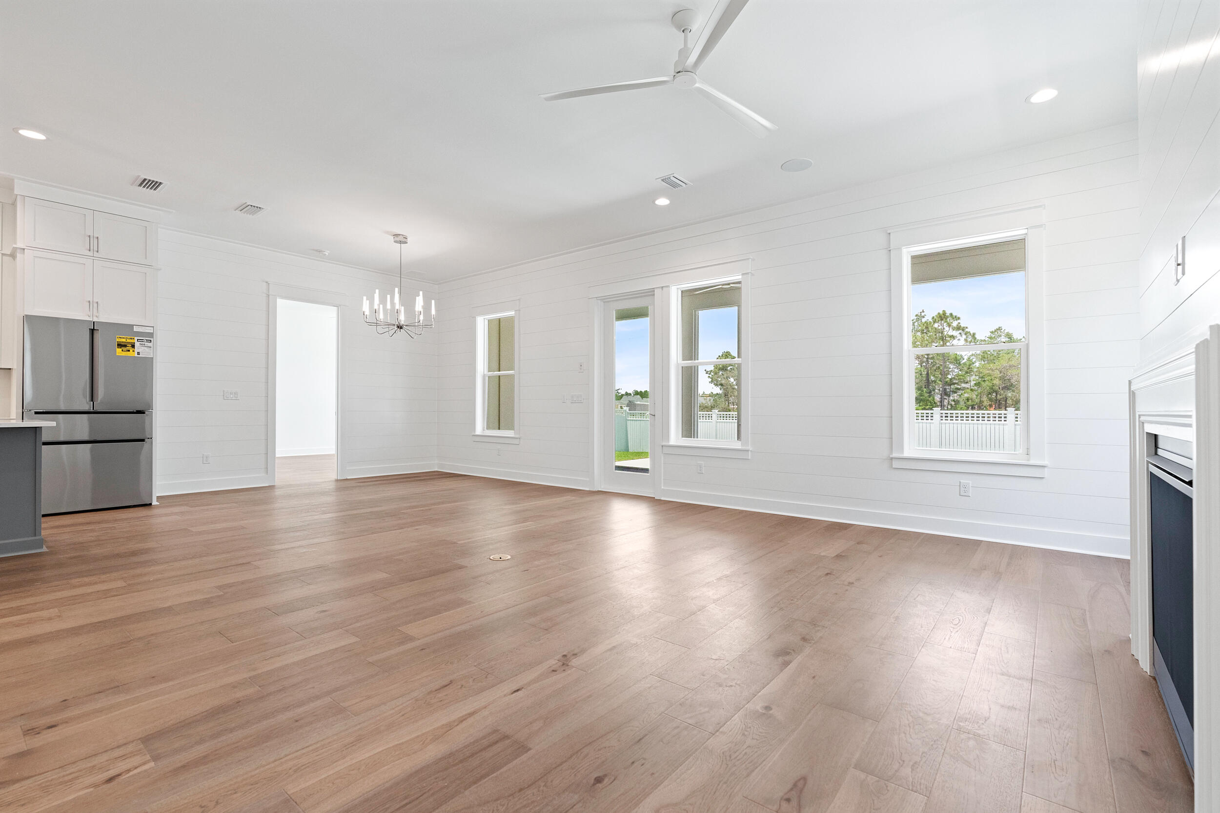 29 Pollard Cove, Unit LOT 3 Watersound, FL 32461 - Photo 20 of 69 an empty room with wooden floor and windows