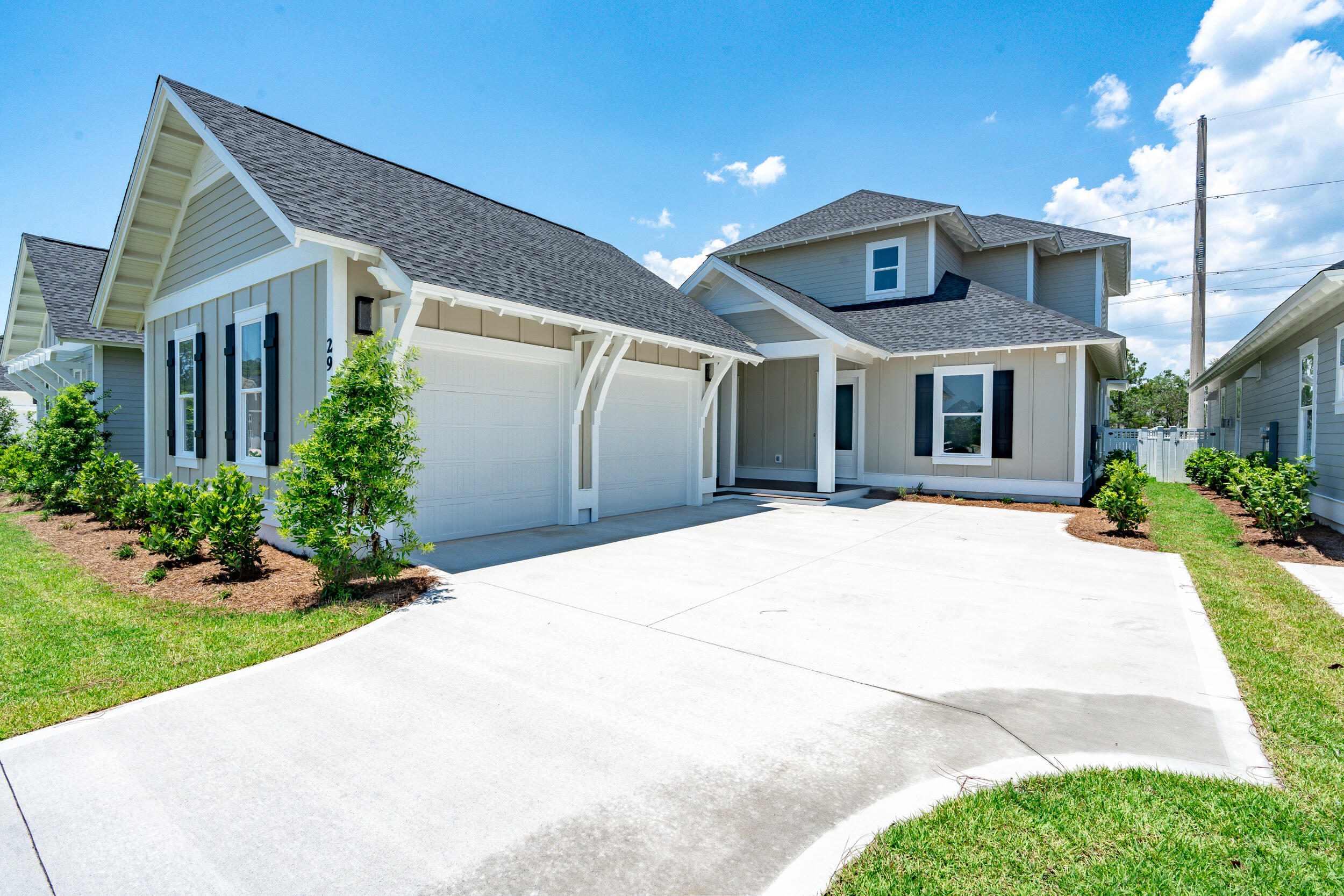 29 Pollard Cove, Unit LOT 3 Watersound, FL 32461 - Photo 2 of 69 a front view of a house with a yard