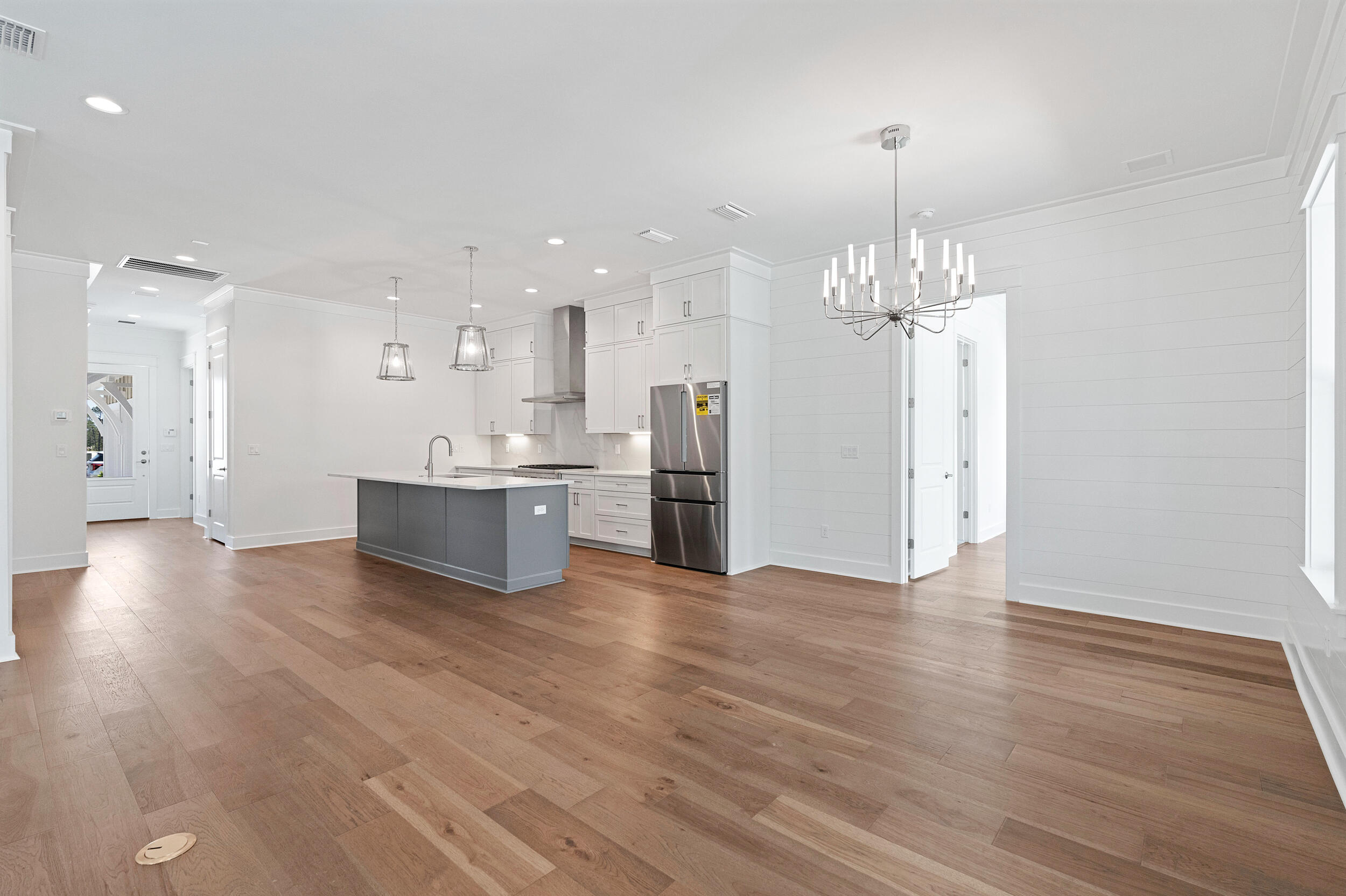 29 Pollard Cove, Unit LOT 3 Watersound, FL 32461 - Photo 22 of 69 a view of a kitchen with granite countertop stainless steel appliances and wooden floor