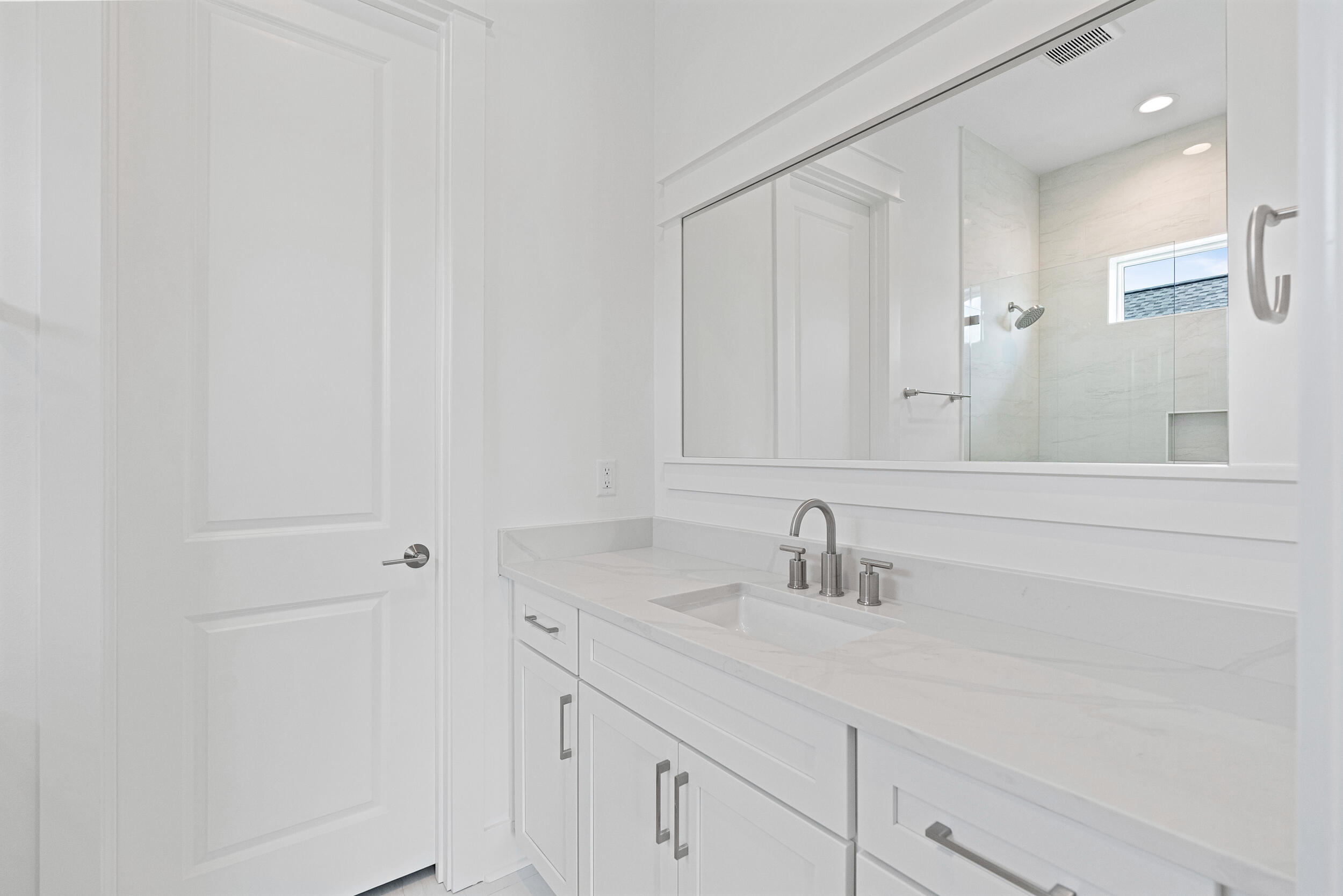 29 Pollard Cove, Unit LOT 3 Watersound, FL 32461 - Photo 35 of 69 a bathroom with a sink and a mirror
