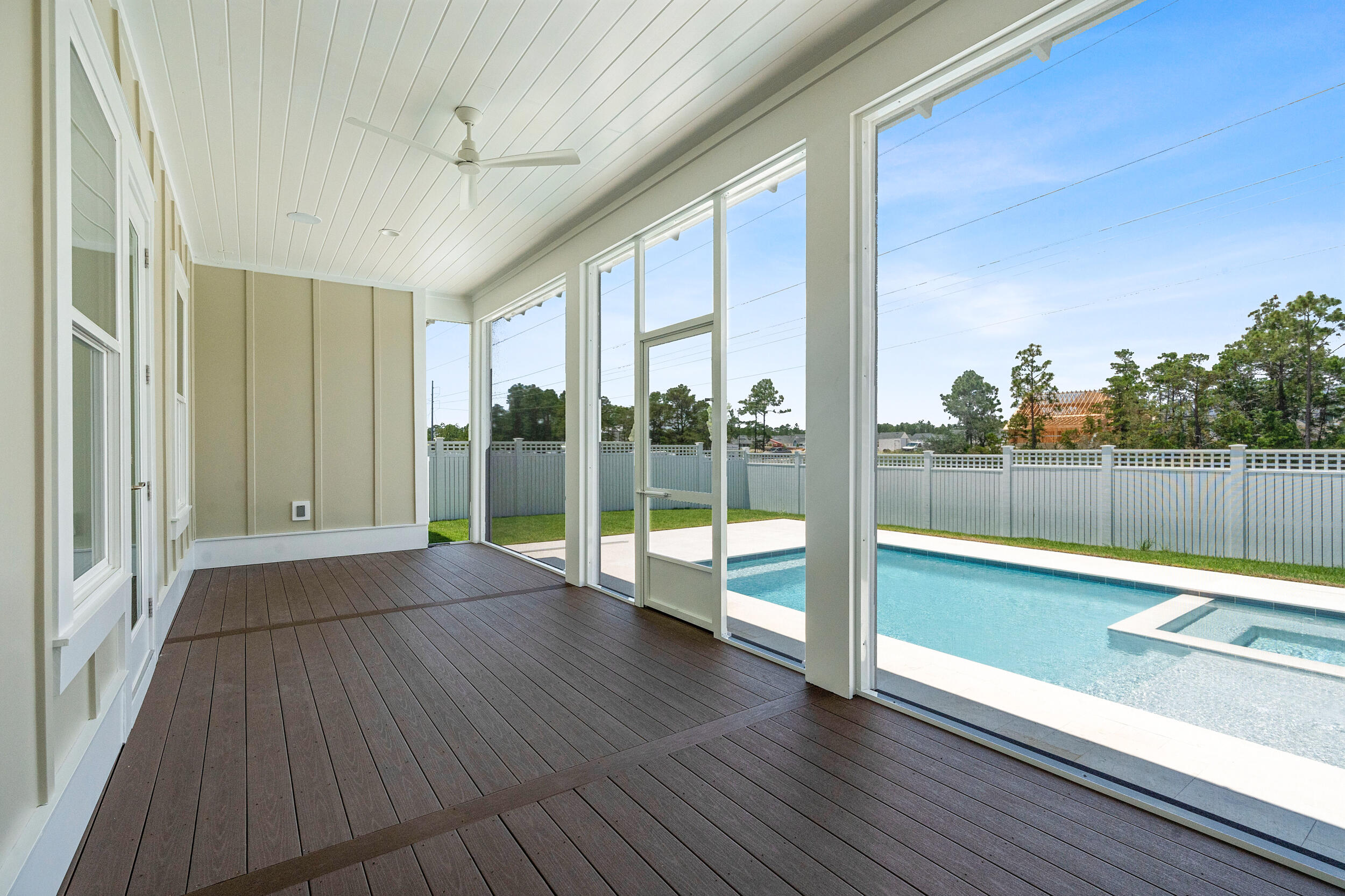 29 Pollard Cove, Unit LOT 3 Watersound, FL 32461 - Photo 38 of 69 a view of an empty room with wooden floor and windows