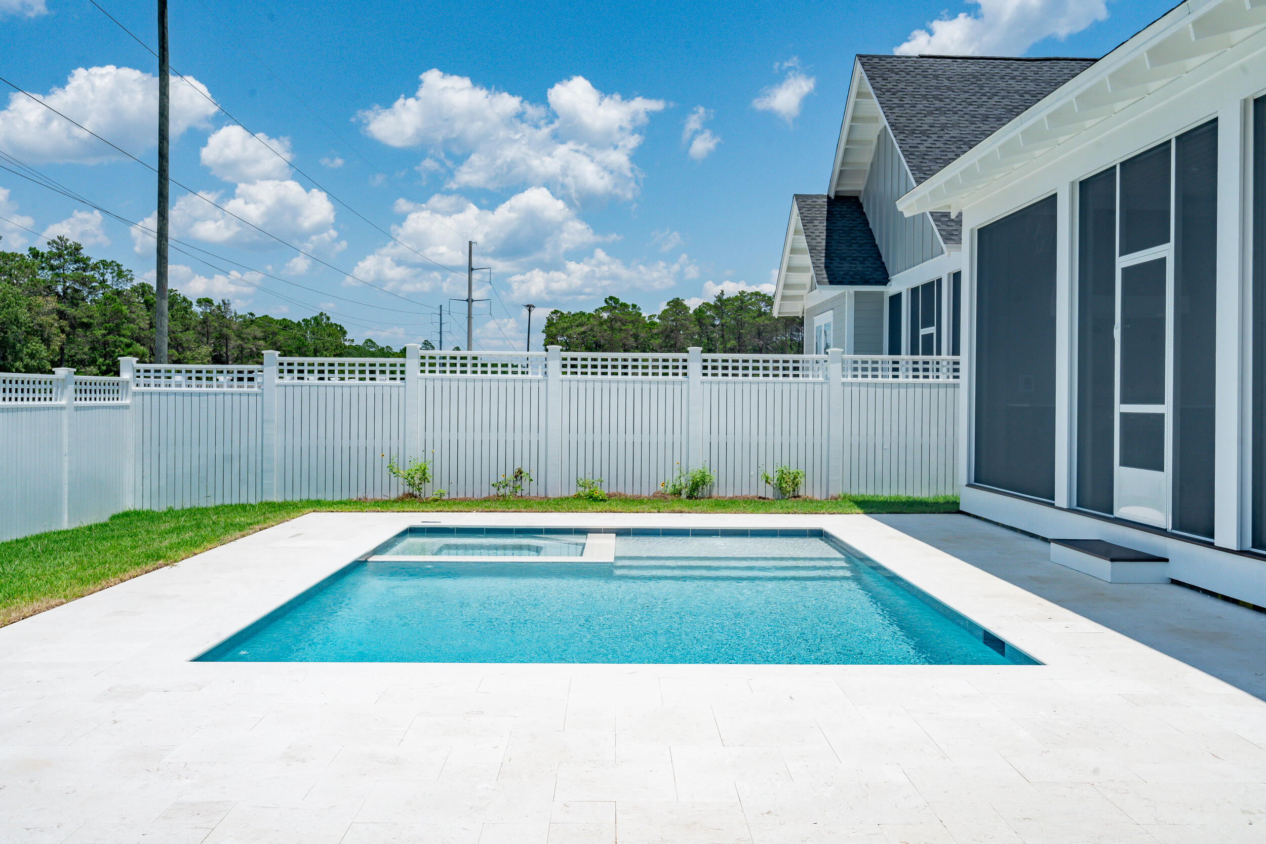 29 Pollard Cove, Unit LOT 3 Watersound, FL 32461 - Photo 40 of 69 a view of a swimming pool with a yard and a basket ball ground