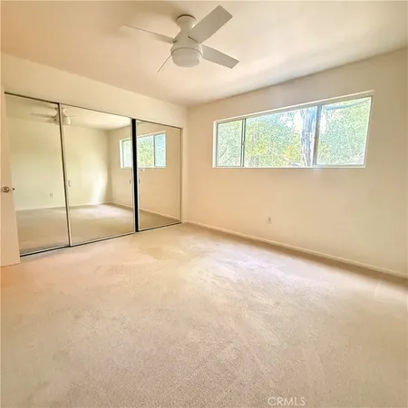 a bathroom with a shower and a toilet