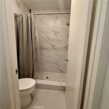 a spacious bathroom with a double vanity sink a mirror and a bathtub