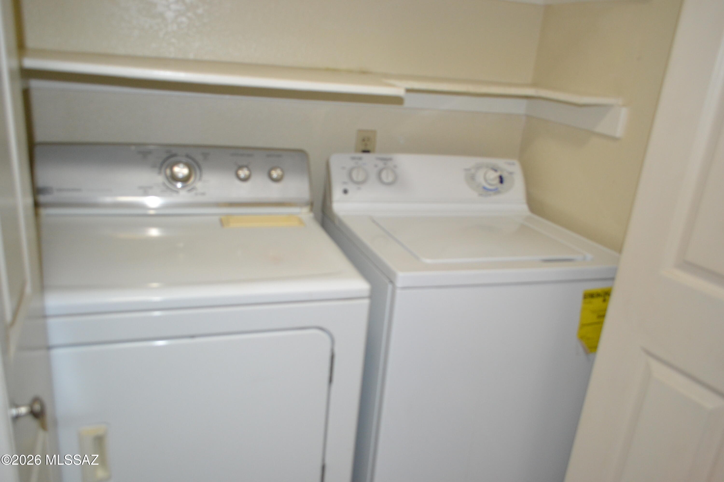 1200 East River Road, Unit D47 Tucson, AZ 85718 - Photo 6 of 13 a utility room with dryer and washer