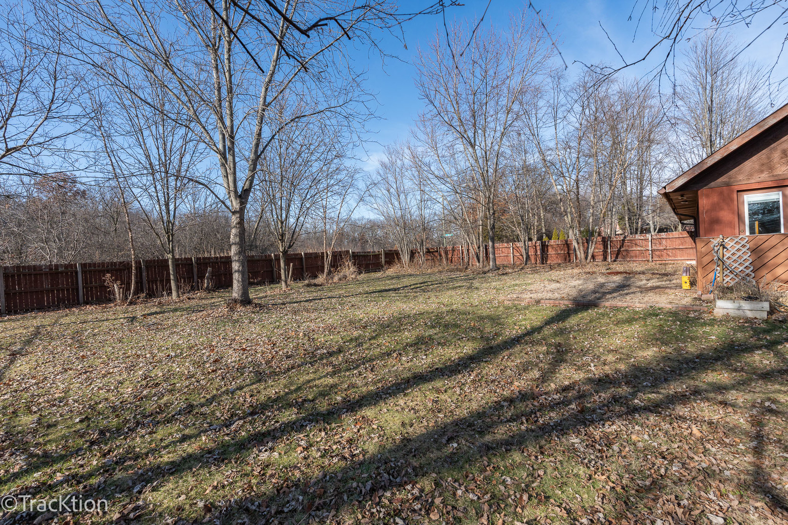 17-w463 Red Oak Avenue Addison, IL 60101 - Photo 4 of 6 a backyard of a house with large trees and outdoor seating
