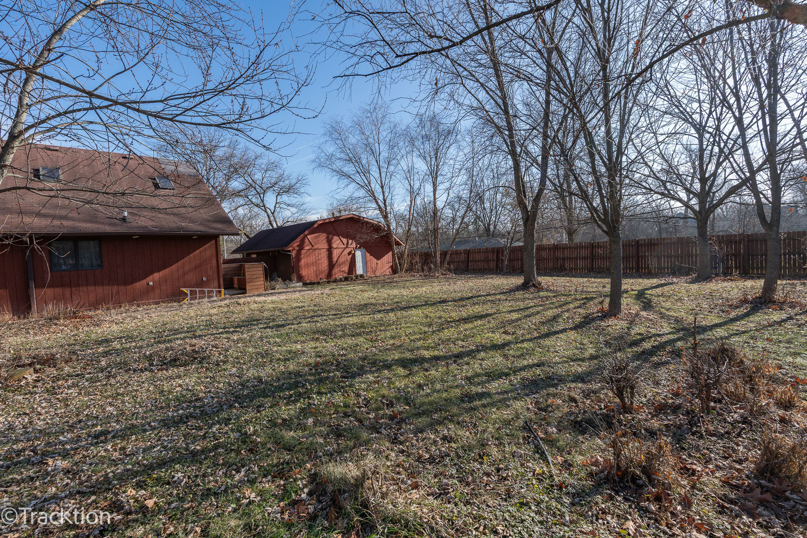 17-w463 Red Oak Avenue Addison, IL 60101 - Photo 5 of 6 a view of a wooden house with a yard