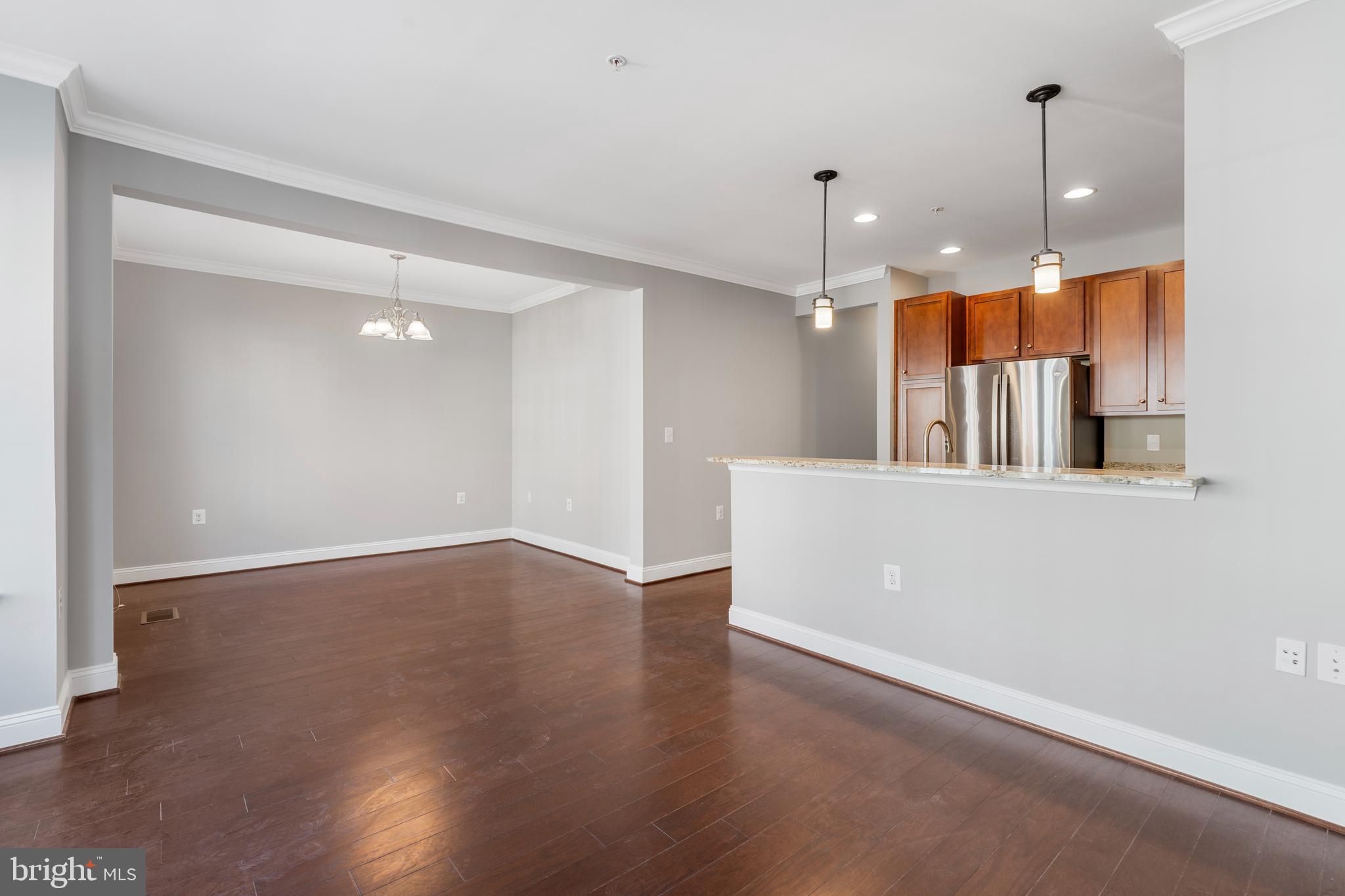 11246 Chase Street, Unit 141 Fulton, MD 20759 - Photo 16 of 37 a view of a kitchen with a dishwasher and a refrigerator