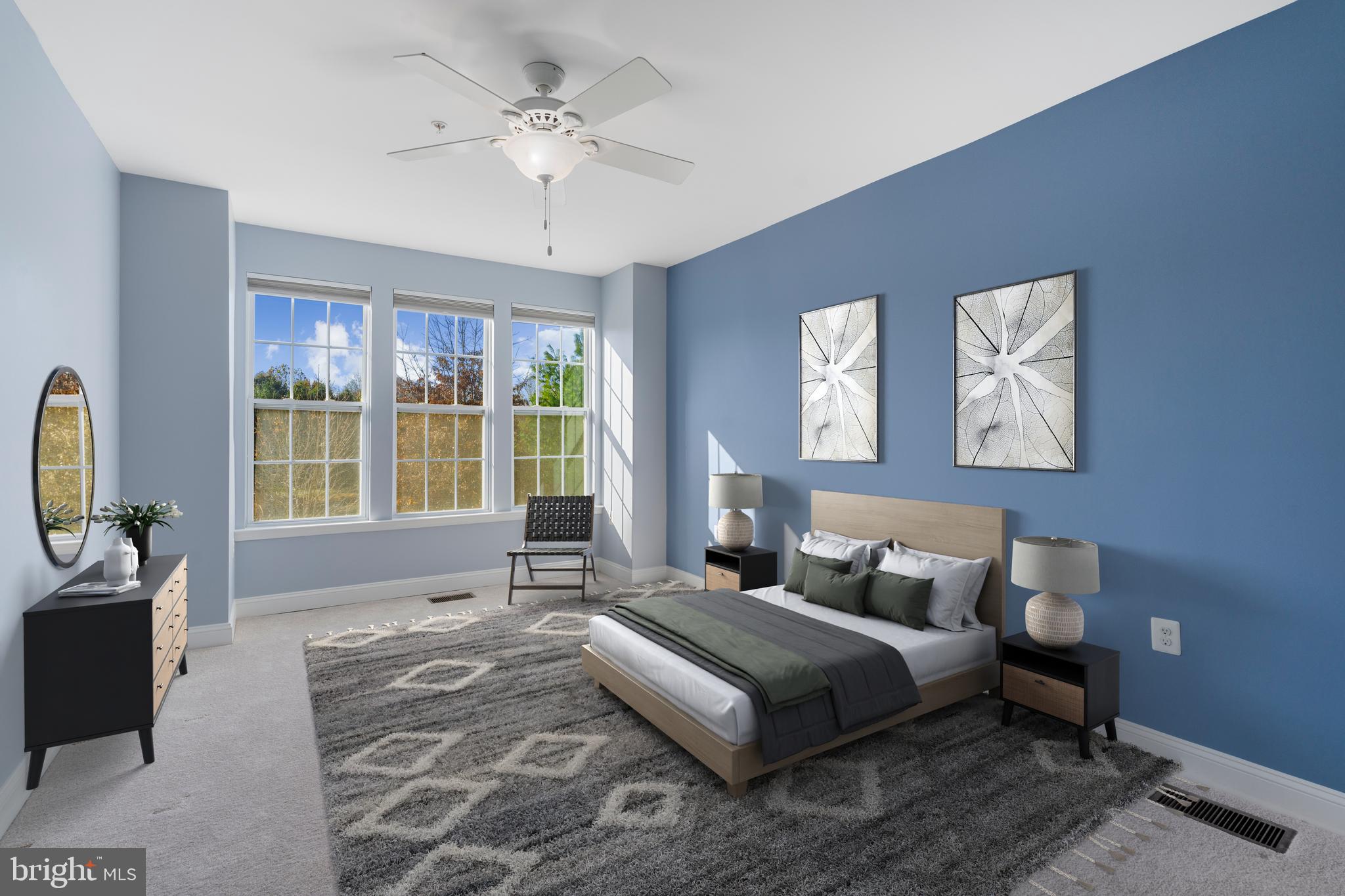 11246 Chase Street, Unit 141 Fulton, MD 20759 - Photo 21 of 37 a spacious bedroom with a large bed and a window