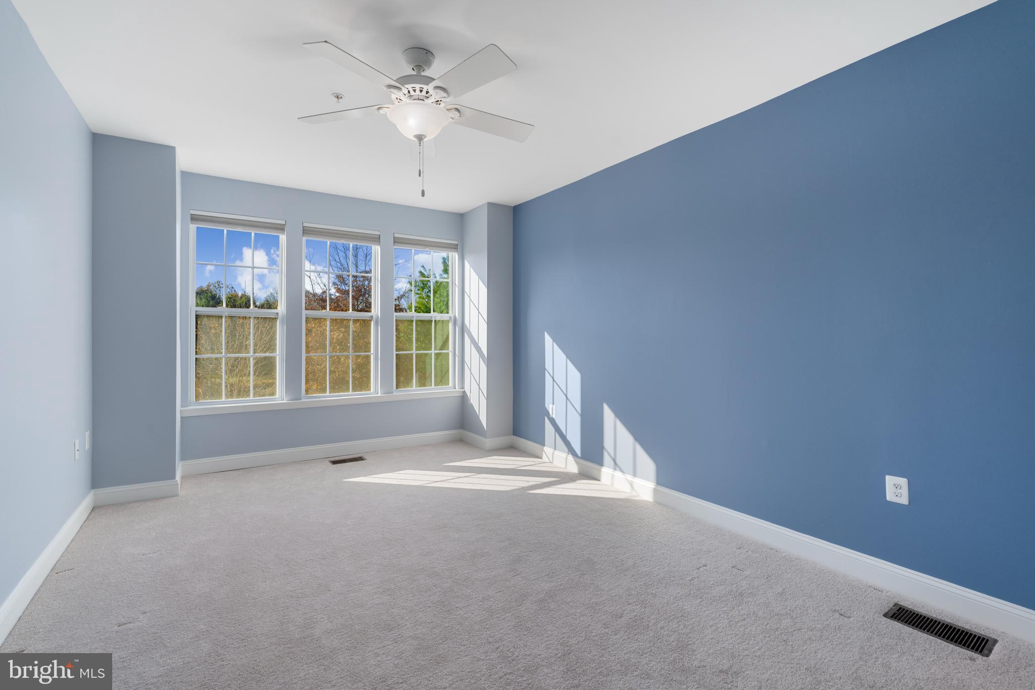 11246 Chase Street, Unit 141 Fulton, MD 20759 - Photo 23 of 37 a view of livingroom with a ceiling fan and window